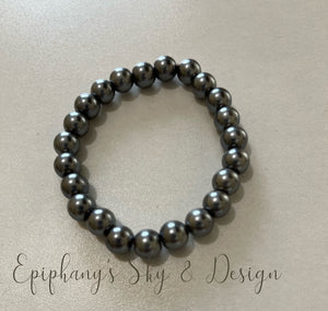 BRACELETS: Shiny, pearl-beaded bracelets
