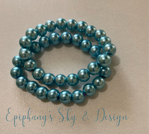 BRACELETS: Shiny, pearl-beaded bracelets