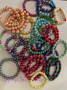 BRACELETS: Shiny, pearl-beaded bracelets