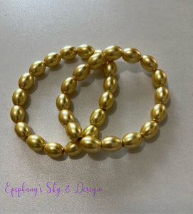 BRACELETS: Shiny, pearl-beaded bracelets