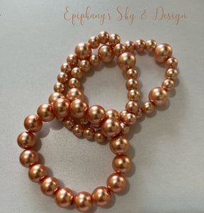 BRACELETS: Shiny, pearl-beaded bracelets